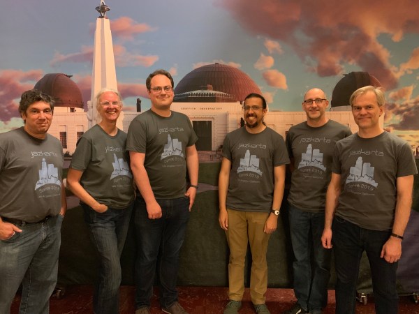 Left to right: Carlos, Sally, Matthew, Alec, Jesse and Nate in front of a painting of the Griffith Observatory